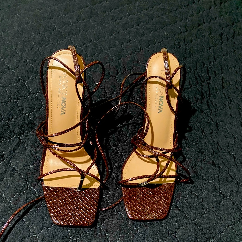 Brown faux snake skin tie up heels.